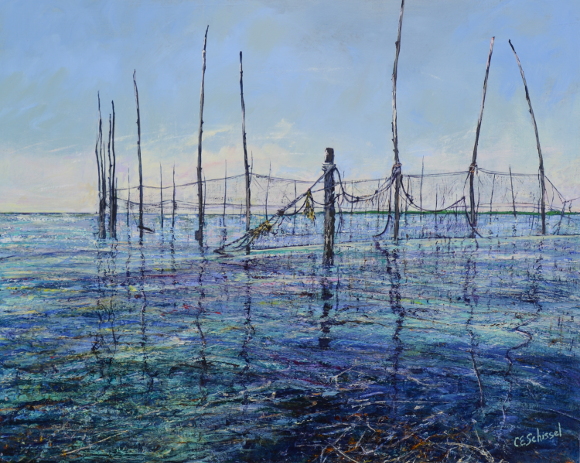 Herring Weir in shallow water, surrounded by fishing nets on poles, under clear skies.